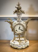 An ornate reproduction gilt metal mounted mantel clock, with key, height 41 cm.