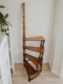 A reproduction stained yew wood spiral library step,