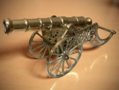 A brass model cannon on carriage, length 40 cm.