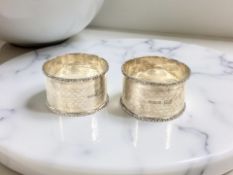 A pair of George V silver napkin rings, Walker & Hall, Birmingham 1919.
