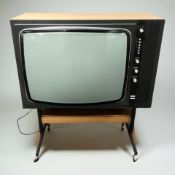 A vintage Decca teak cased television on castors, 76 cm x 35 cm x 87 cm.