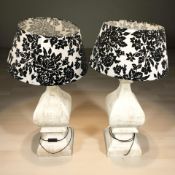 A pair of contemporary wooden table lamps with shades, height 90 cm.