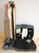 A group of lawn bowls, walking sticks,