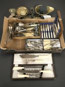 Assorted EPNS cutlery, a large brass bell weight,
