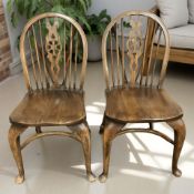A pair of elm wheel back with crinoline understretchers