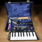 A Boosey & Hawkes Regent II clarinet in case, and a Hohner Melodica.