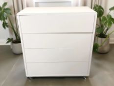 A modern white laminated four drawer chest, 90 cm x 40 cm x 96 cm.