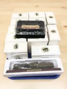 A group of boxed die cast trams, model locomotive, etc.