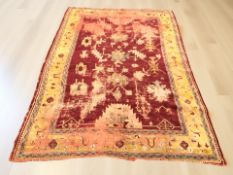 An Eastern woolen carpet 270 cm x 188 cm together with a similar runner (2) CONDITION