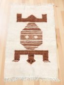 An eastern flatweave Kilim, 130 cm x 79 cm, together with an Iranian Heriz rug,