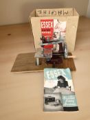 An Essex electric miniature portable sewing machine with box