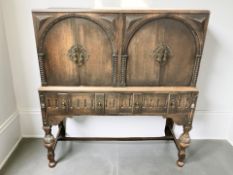 A 20th century oak four door drinks cabinet ,