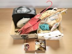 A group of lady's handbags, parasols, hats,