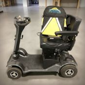 A Sterling Sapphire electric mobility scooter with charging lead and two keys.
