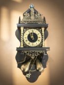 A reproduction Dutch style wall clock with brass pear drop weights, height 63 cm.