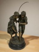 A patinated spelter figure group of a lady and gentleman fishing, height 46 cm.