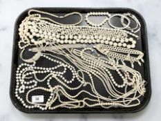 A large group of faux pearl jewellery, necklaces,