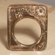 An Arts and Crafts copper picture frame surround, 22 cm x 19 cm.