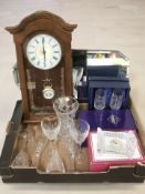 An Art Deco frameless mirror, a reproduction wall clock, Edinburgh Crystal vase,