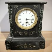 A Victorian black slate and green marble mantel clock, height 28 cm.