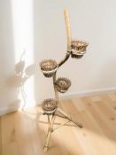 A bentwood and wicker plant pot stand, height 140 cm.