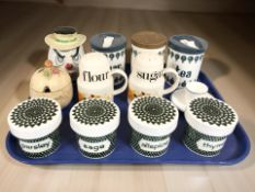 A group of kitchen storage jars including Poole, a Shelley egg cup, etc.