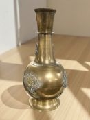 An Aesthetic Period embossed brass vase, height 31 cm.