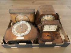 Four Art Deco mantel clocks and a further wall clock.
