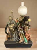 A group of fire companion pieces, brass lamp bases, an oil lamp, garden sprayer.