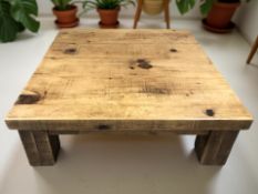 A large pine square low coffee table, 121 cm x 41 cm.