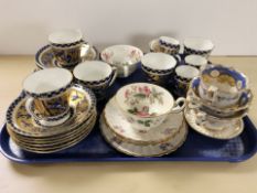 Twenty one pieces of Coalport tea and coffee china decorated with birds in flight on cobalt blue