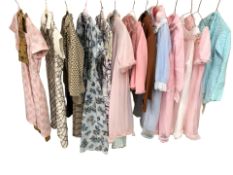 A rail and three boxes of assorted vintage lady's clothing including various dresses, undergarments,