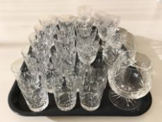 A collection of crystal drinking glasses in various sizes.