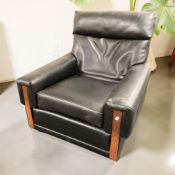 A Scandinavian black faux leather upholstered lounge chair, width 85 cm.