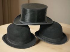 Two black felt bowler hats and a top hat.