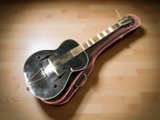 A home made jazz-style hollow bodied acoustic guitar, length 107 cm, with soft carry bag.