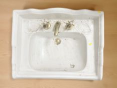 A large porcelain sink, width 74 cm.