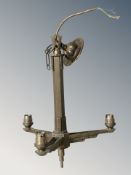 An early 20th century brass three branch pendant light fitting, height 37 cm.