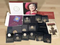 A collection of British coins including various commemorative crowns, fifty pence pieces, etc.
