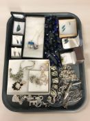 A group of costume jewellery including New Zealand Paua shell iridescent pendants and similar