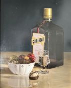 C A Whitfield (20th century) Still life of Cointreau and chocolates, oil on board, 26 cm x 32 cm.