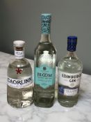 A 70 cl bottle of Edinburgh Classic Dry Gin, a 70 cl bottle of Caorunn Scottish Gin,