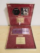 Two modern CD montages recognising sales of 100,