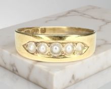 An antique 18ct yellow gold ring set with seed pearls, size N CONDITION REPORT: 2.