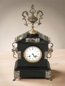 A Victorian black slate and marble eight day mantel clock, with pendulum and key,