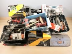 A collection of power tools, hand tools and hardware.