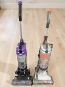 Two Vax upright vacuum cleaners.