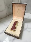 A Dunhill red enamel Rollagas lighter in original box