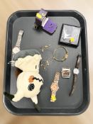 A group of costume jewellery, wristwatches, miniature cannon ornament, soft toy.