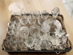 A collection of crystal drinking glasses, ships decanter, crystal candle holders, etc.